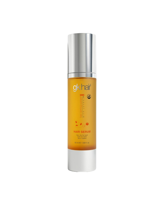 gk Hair serum bottle with silver cap and orange label on a white background