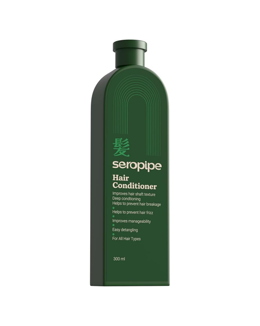 Green bottle of seropipe hair conditioner on a white background