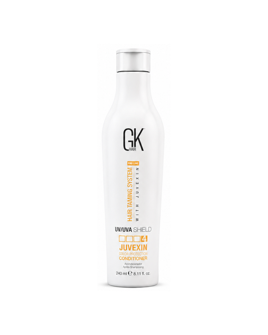 White bottle of GK Hair care product on a white background