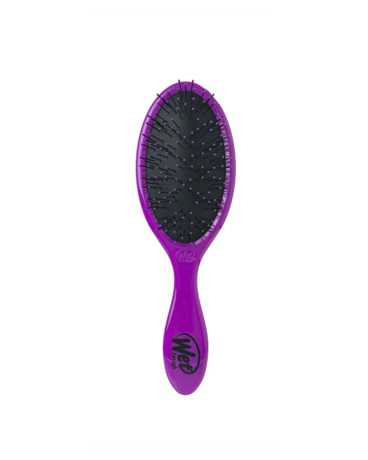 Purple hairbrush with black bristles on a white background
