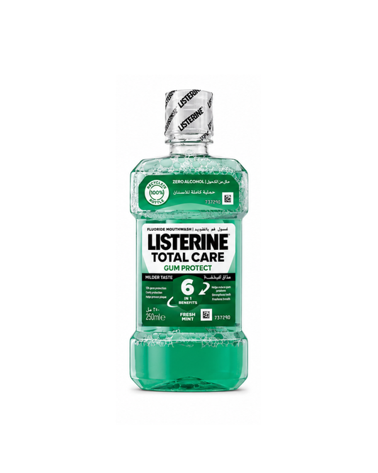 Bottle of Listerine Total Care mouthwash on a white background